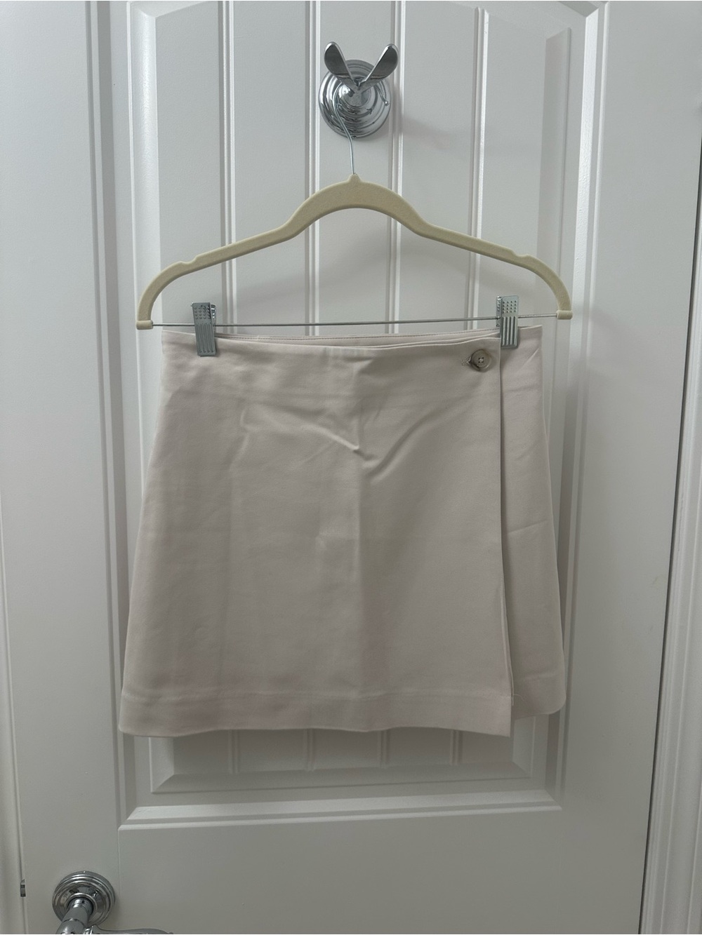 Babaton Light Cream Wrap-Style Mini Skirt with Button Accent